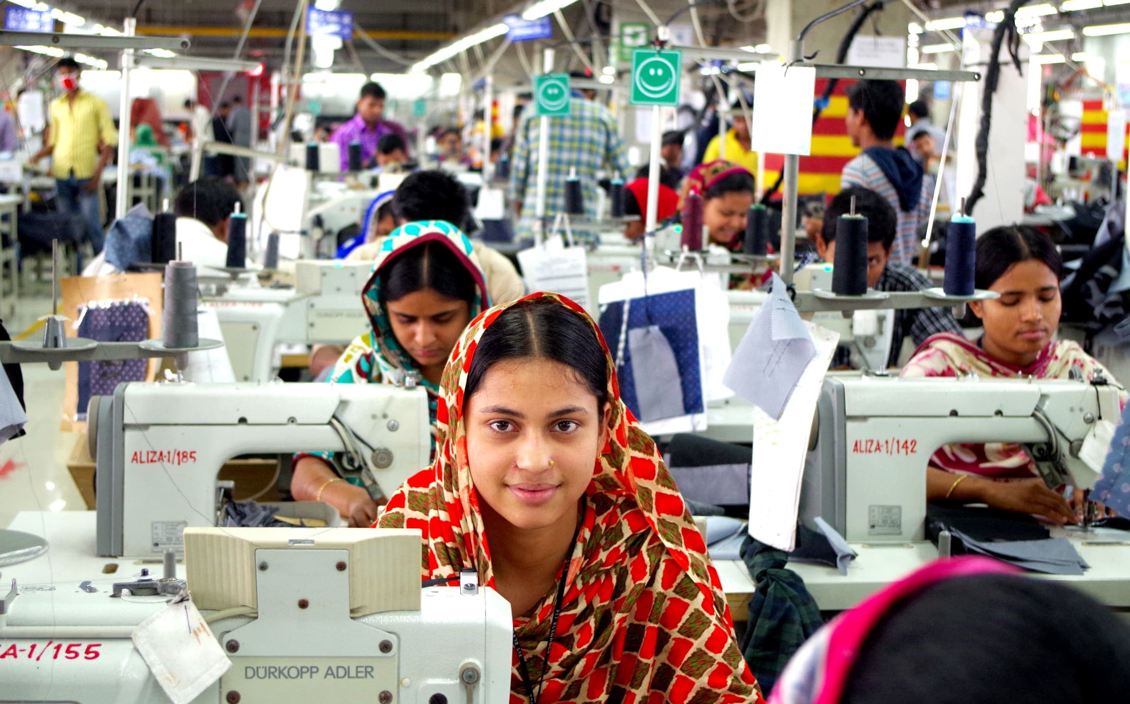 Textile factory worker at a loom
